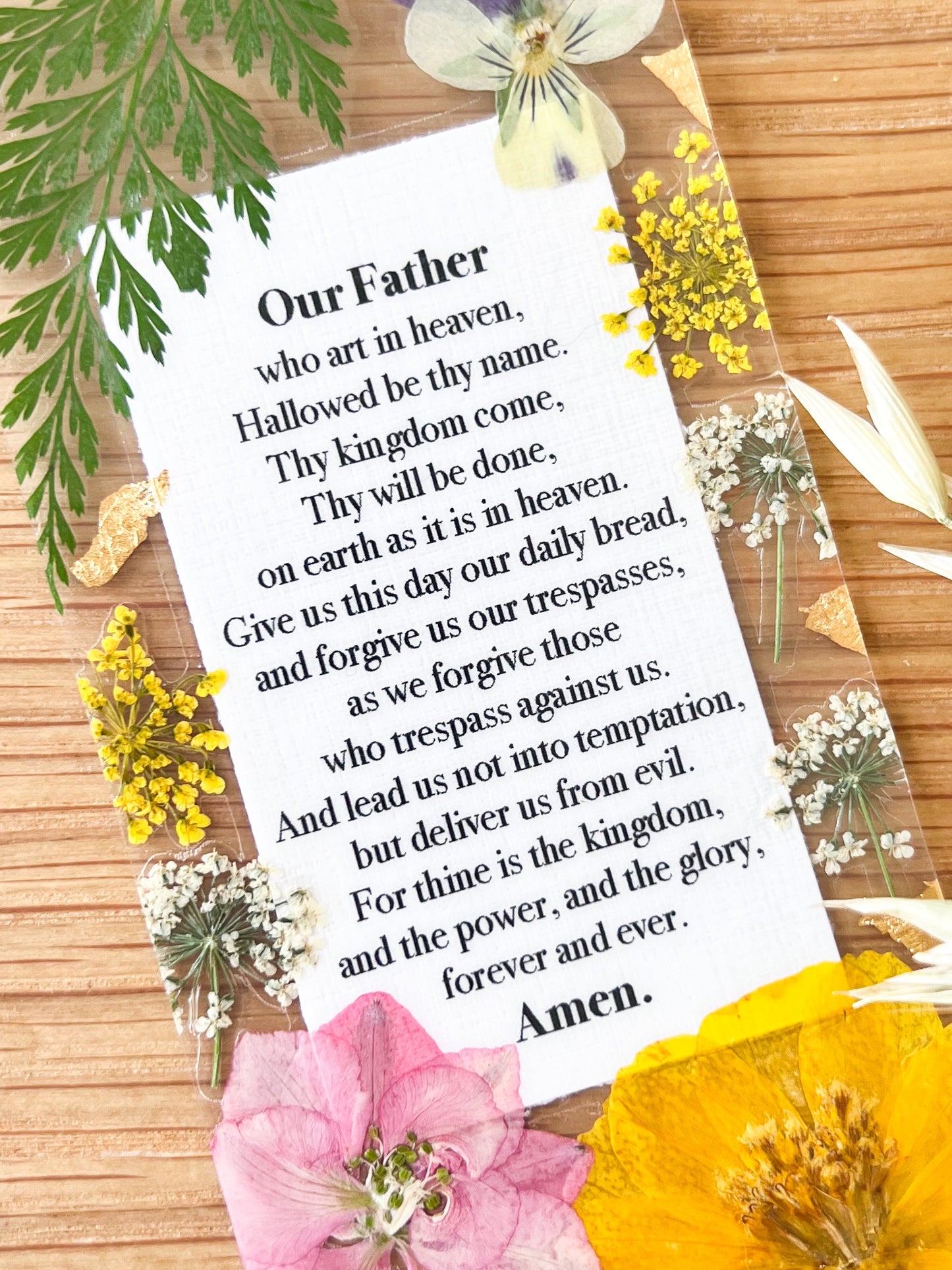 Bookmark includes the following Lord's Prayer : "Our Father who art in heaven, Hallowed be thy name. Thy kingdom come, Thy will be done, on earth as it is in heaven. Give us this day our daily bread, and forgive us our trespasses, as we forgive those who trespass against us. And lead us not into temptation, but deliver us from evil. For thine is the kingdom, and the power, and the glory, forever and ever. Amen."