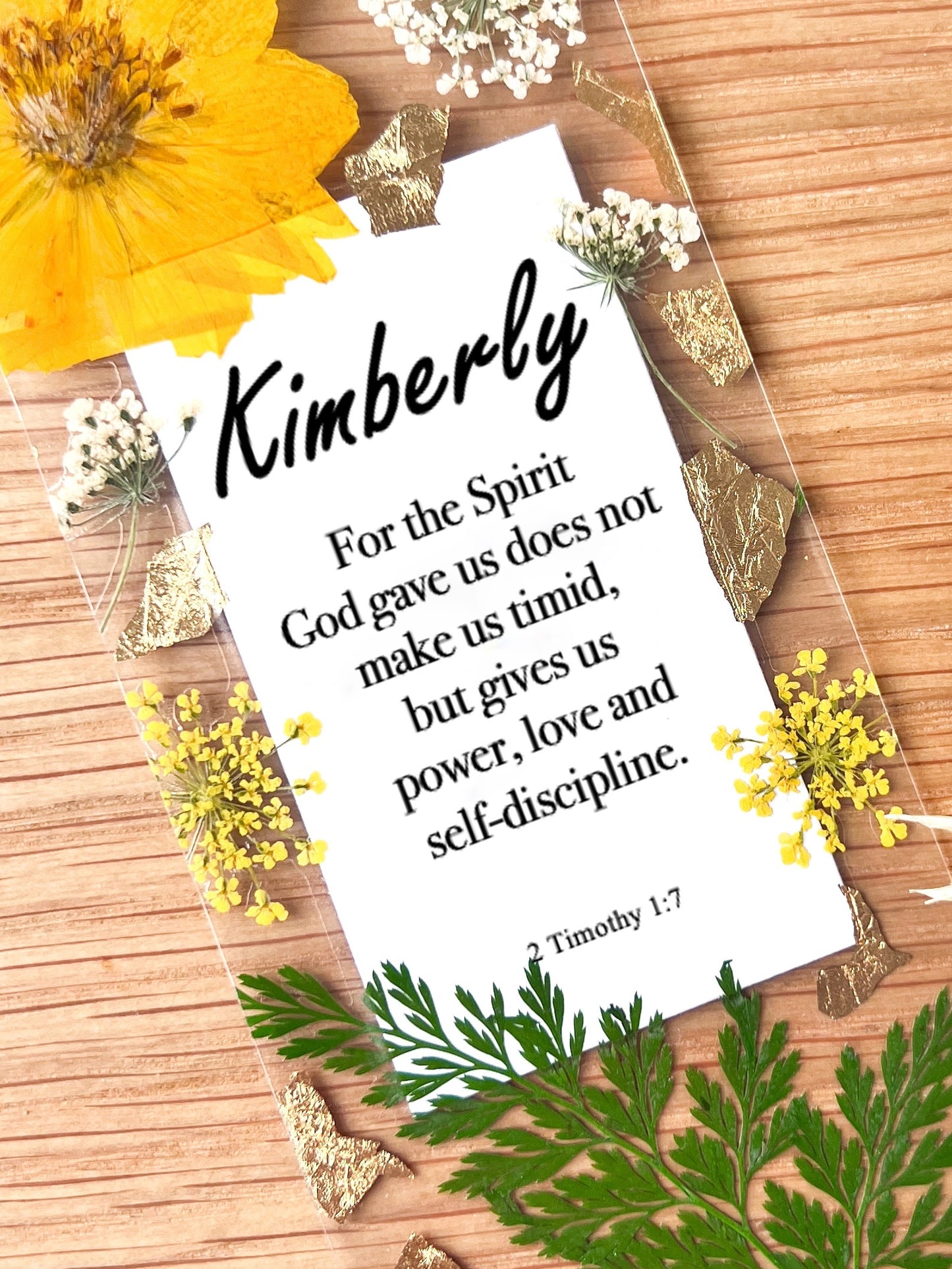 Bookmark includes the following scripture passage : "[custom name] For the Spirit of God gave us does not make us timid, but gives us power, love and self discipline. 2 Timothy 1:7"