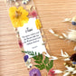  Bookmark includes the following scripture passage : "[custom name] The grass withers and the flowers fall, but the Word of our God endures forever. Isaiah 40:8"