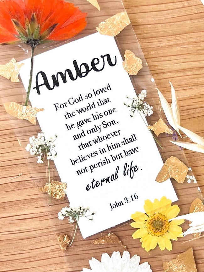  Bookmark includes the following scripture passage : "[custom name] For God so loved the world that he gave his one and only Son, that whoever believes in him shall not perish but have eternal life. John 3:16"