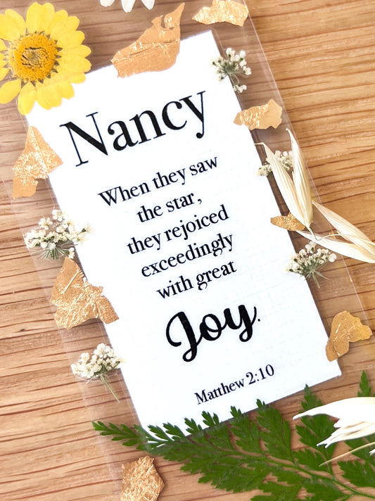  Bookmark includes the following scripture passage : "[custom name] When they saw the star, they rejoiced exceedingly with great joy. Matthew 2:10 "