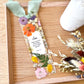  Bookmark includes the following scripture passage : "[custom name] Many women do noble things, but you surpass them all. Proverbs 31:29"