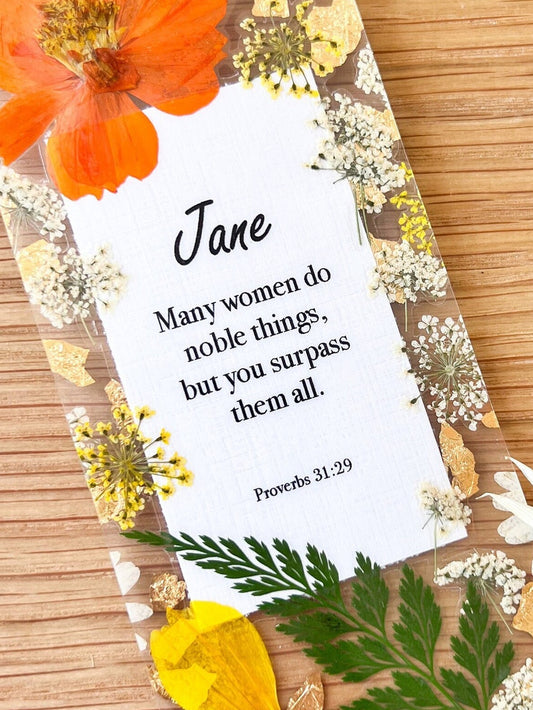  Bookmark includes the following scripture passage : "[custom name] Many women do noble things, but you surpass them all. Proverbs 31:29"