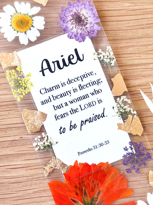  Bookmark includes the following scripture passage : "[custom name] Charm is deceptive, and beauty is fleeting; but a woman who fears the LORD is to be praised. Proverbs 31:30-33"