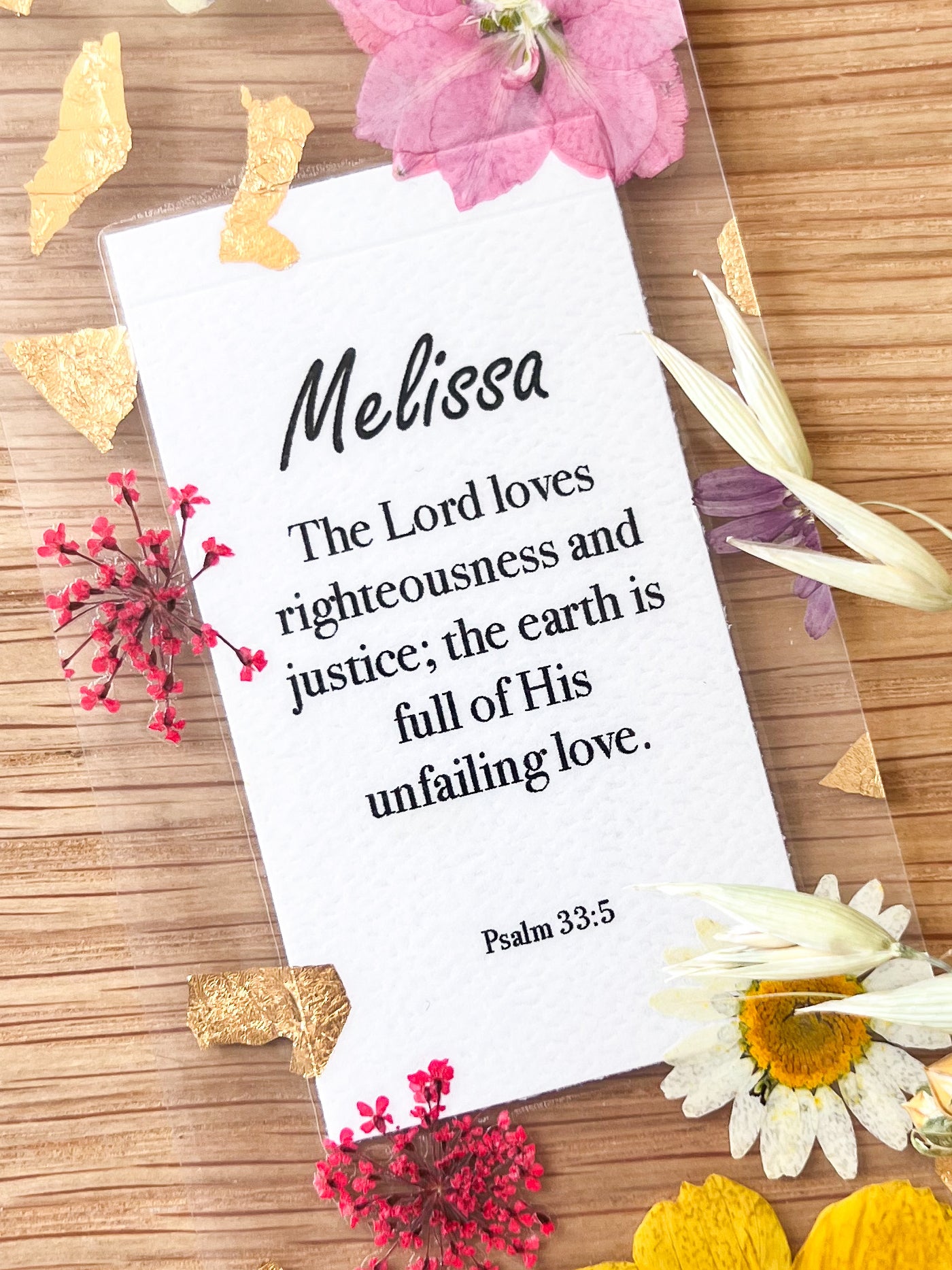 Bookmark includes the following scripture passage : "[custom name] The Lord loves righteousness and justice; the earth is full of His unfailing love. Psalm 33:5 "