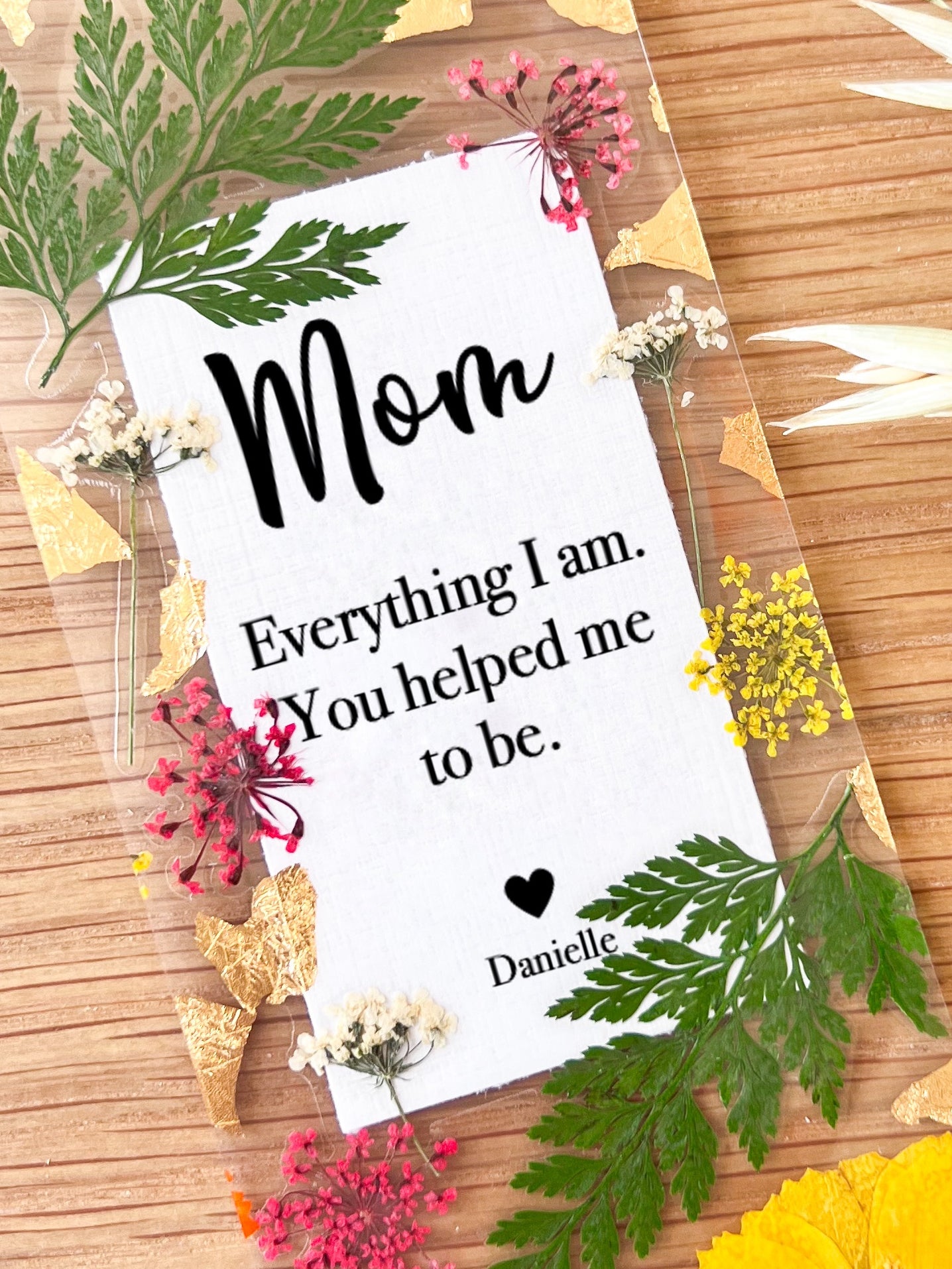 Pressed flower bookmark with quote "Mom Everything I am. You helped me to be."