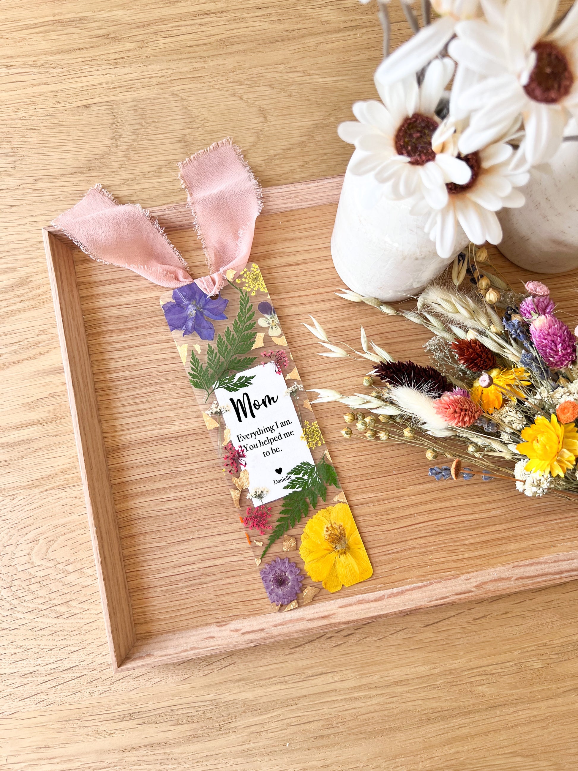 Pressed flower bookmark with quote "Mom Everything I am. You helped me to be."