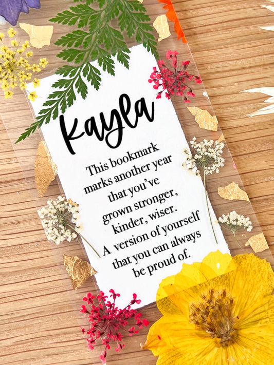 Bookmark includes the following birthday quote : "This bookmark marks another year that you've grown stronger, kinder, wiser. A version of yourself that you can always be proud of. "