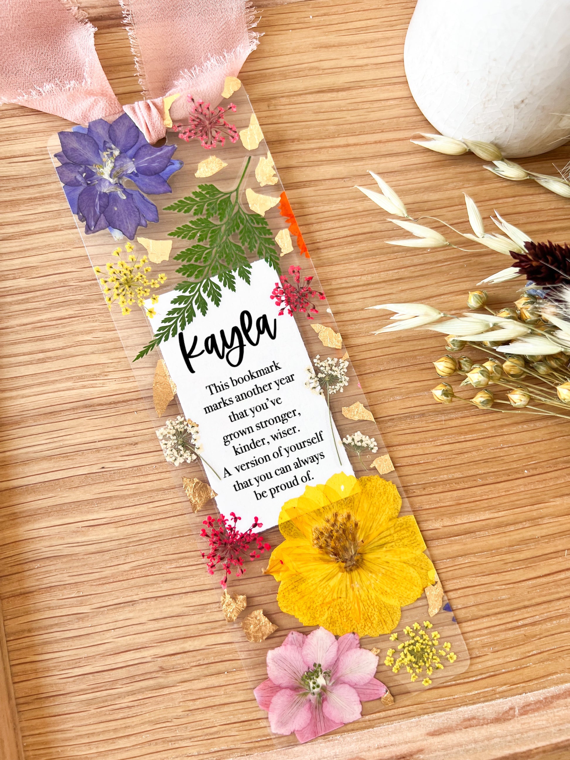 Bookmark includes the following birthday quote : "This bookmark marks another year that you've grown stronger, kinder, wiser. A version of yourself that you can always be proud of. "