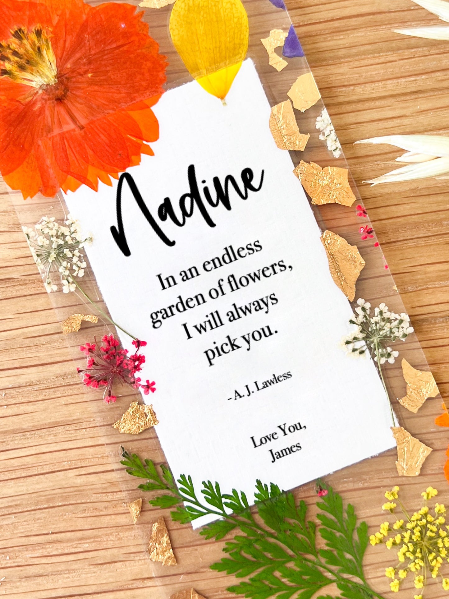 Bookmark includes the following romantic quote by A.J. Lawless: "[custom name] In an endless garden of flower, I will always pick you. Love You, [custom name]"