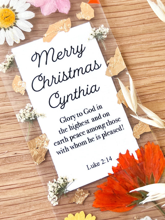  Bookmark includes the following scripture passage : "Merry Christmas [custom name] Glory to God in the highest and on earth peace among those with whom he is pleased! Luke 2:14