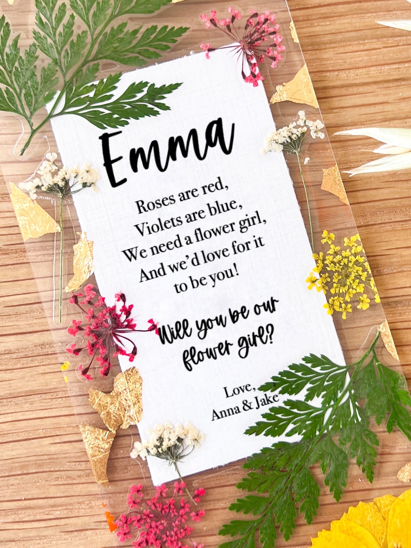  Bookmark includes the following message : "[custom name] Roses are red, Violets are blue. We need a flower girl, And we'd love for it to be you! Will you be our flower girl? Love, [custom names]"