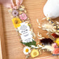 Bookmark includes the following romantic quote by Emily Brontë (Wuthering Heights): "He's more myself than I am. Whatever our souls are made of, his and mine are the same. [custom names][custom dates]"