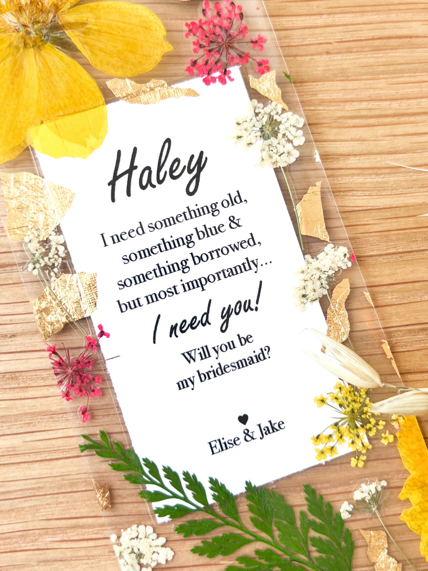  Bookmark includes the following quote : "[custom name] I need something old, something blue & something borrowed... but most importantly.. I need you! Will you be my bridesmaid? [custom names]"